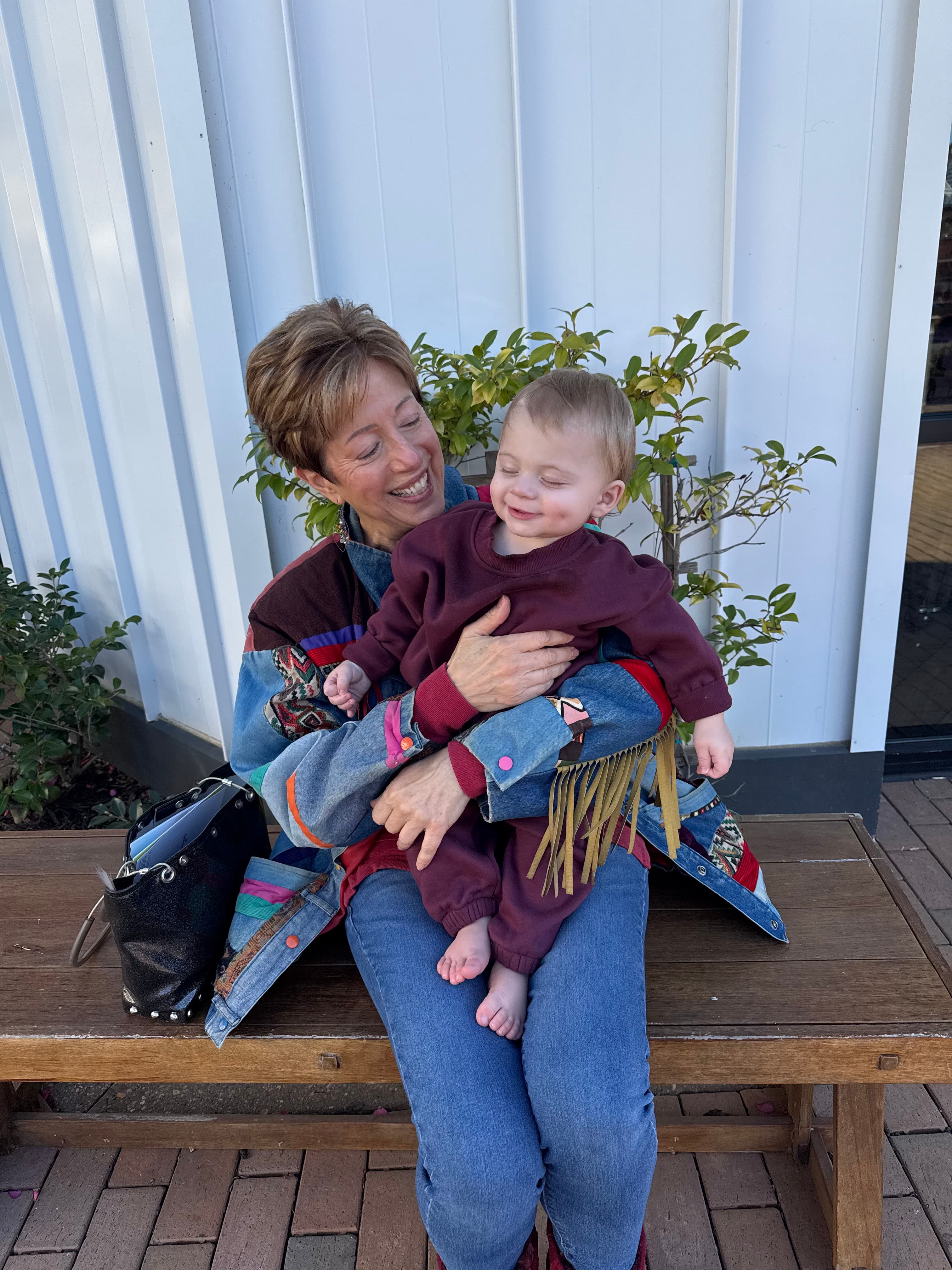 Kathy with her grandchild